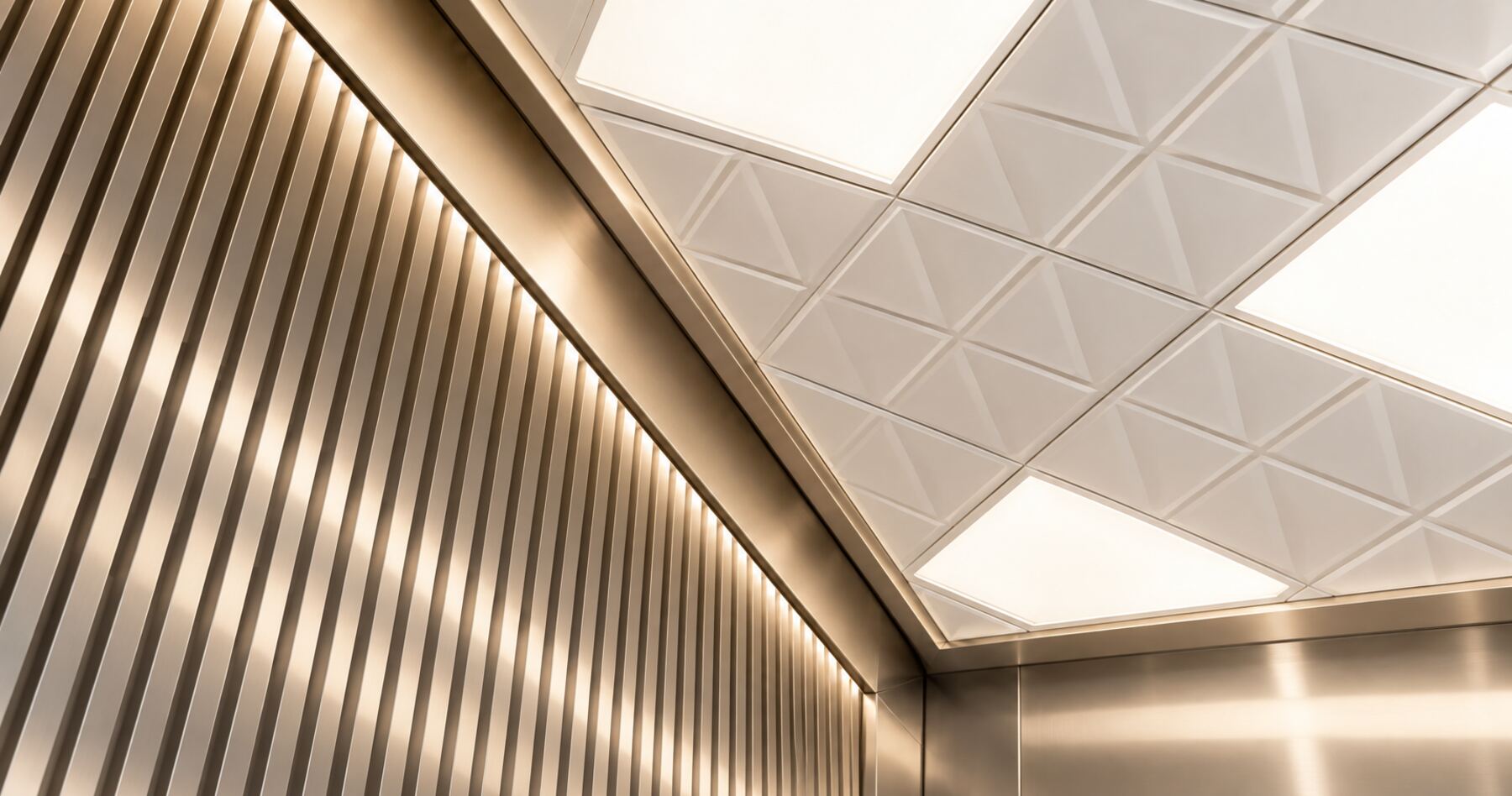 Elevator car ceiling with backlit panels and brushed metal slats