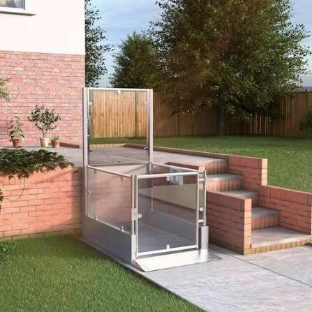 Outdoor platform lift with a glass enclosure leading down to the basement